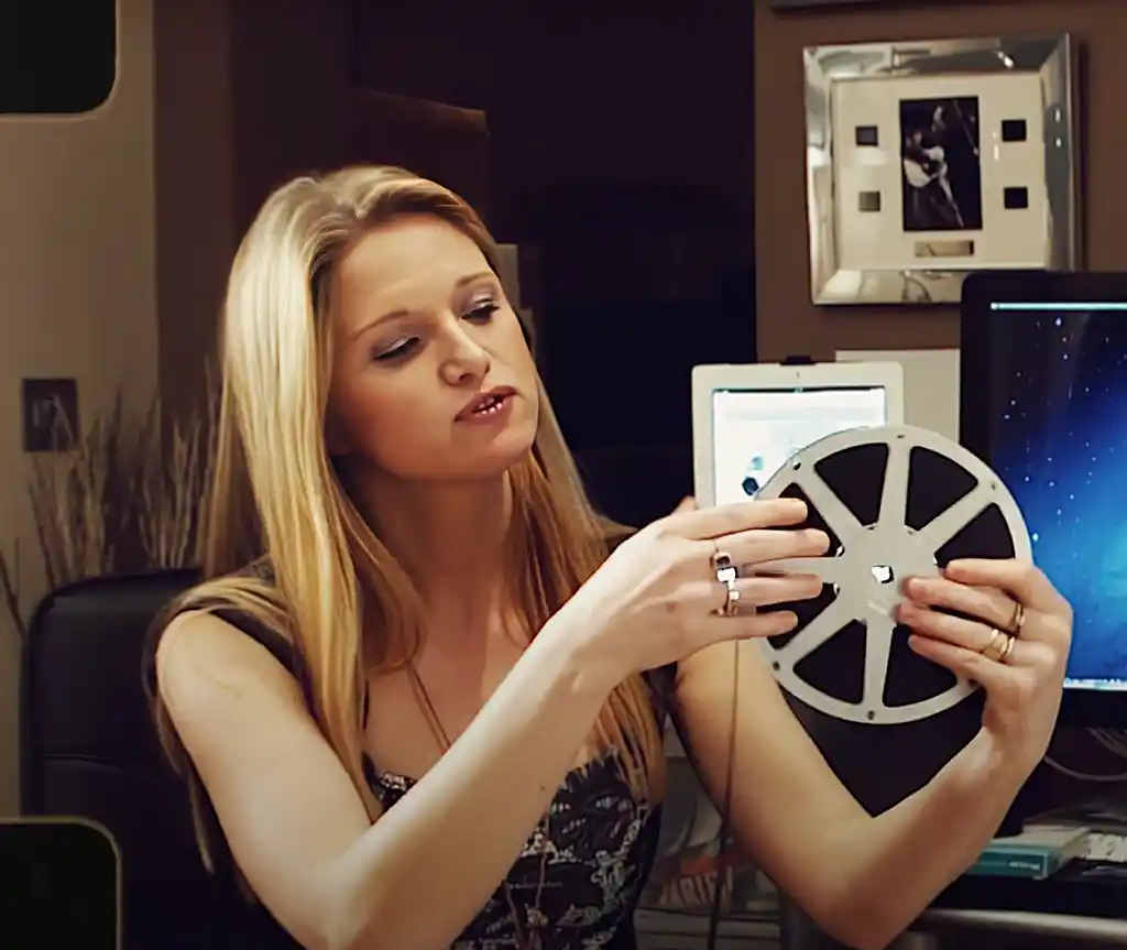 Jennie inspecting a reel of 16mm film