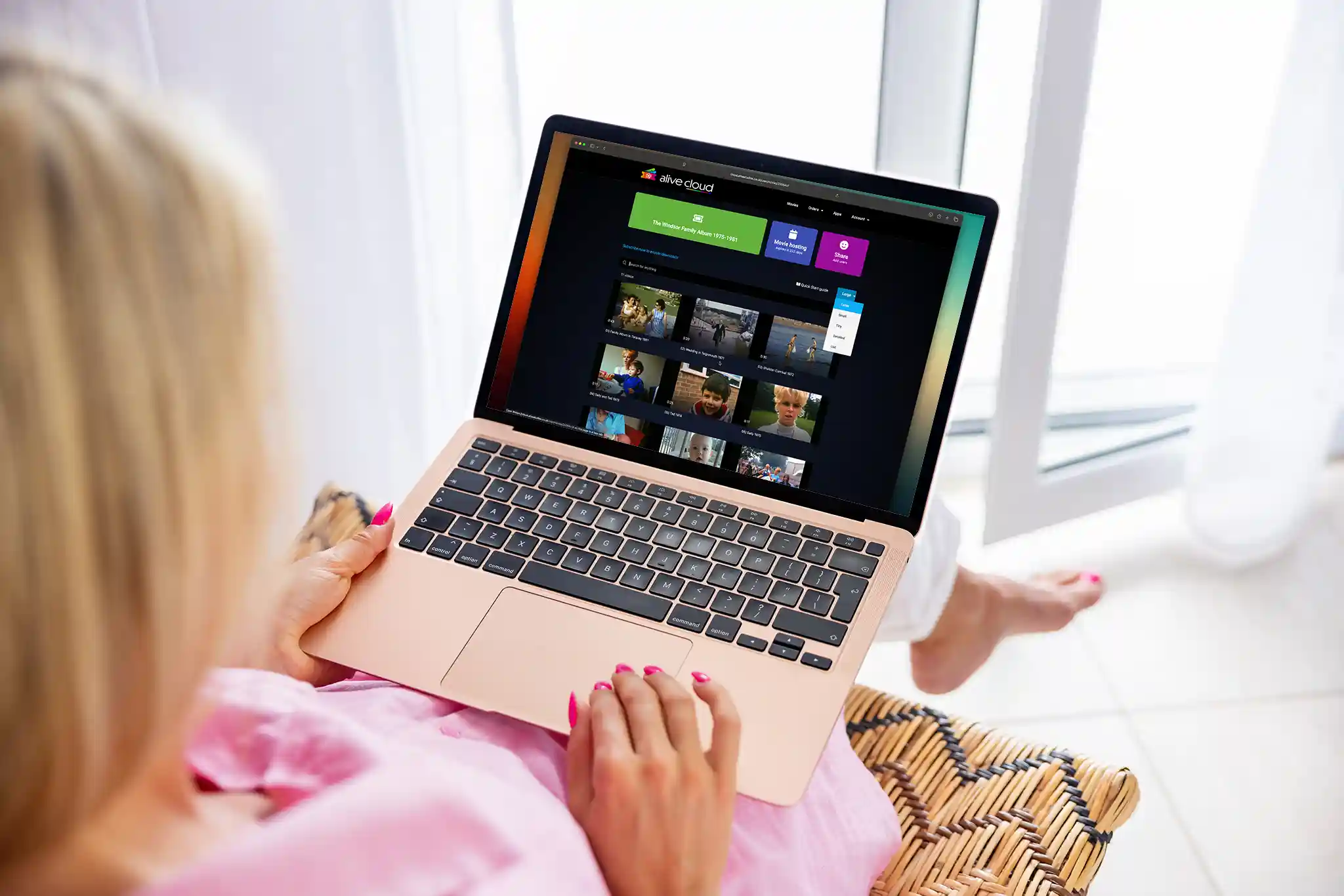 Woman on a MacBook Air running Alive Cloud